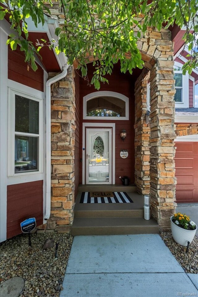 8051 W 78th Cir, Arvada, CO 80005 - property entrance with stone siding