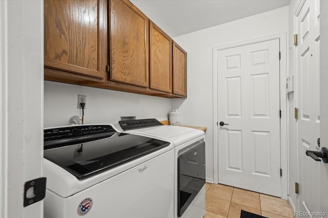 8051 W 78th Cir, Arvada, CO 80005 - laundry area featuring separate washer and dryer, cabinet space, and light tile patterned flooring