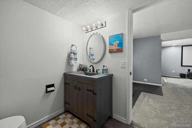 8051 W 78th Cir, Arvada, CO 80005 - bathroom featuring a textured ceiling and vanity
