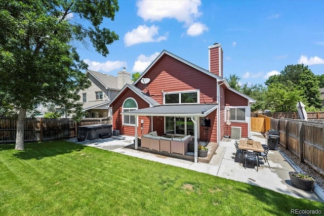 8051 W 78th Cir, Arvada, CO 80005 - rear view of property with a hot tub, a patio area, a fenced backyard, an outdoor hangout area, and a chimney