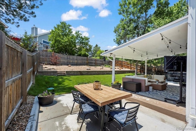 8051 W 78th Cir, Arvada, CO 80005 - fenced backyard featuring a patio area, outdoor lounge area, and outdoor dining area