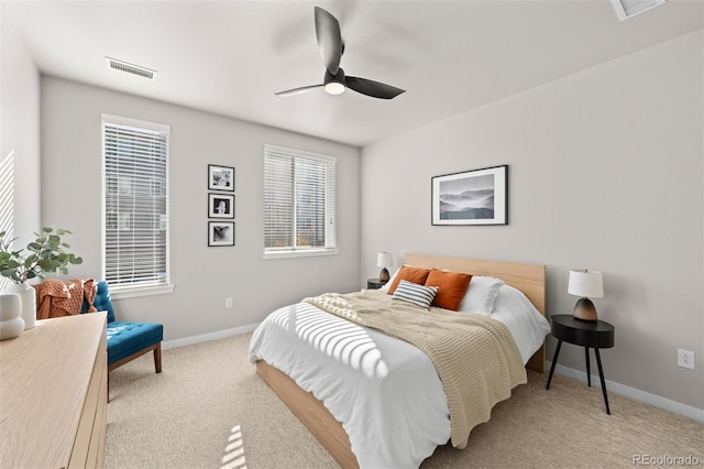 bedroom featuring ceiling fan and light carpet