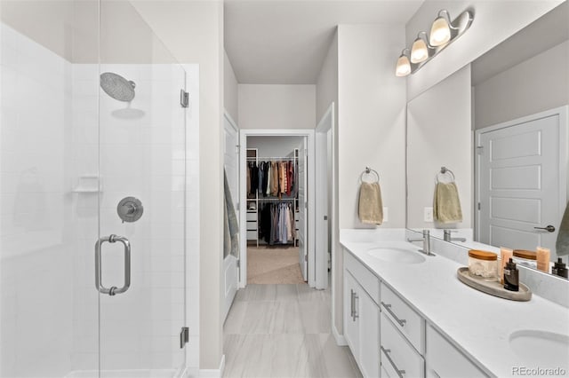 bathroom featuring vanity and an enclosed shower