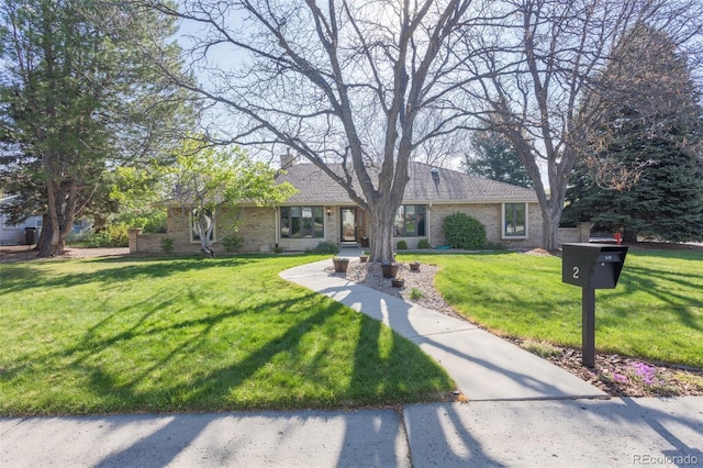 2 Larkdale Dr, Littleton, CO 80123 - single story home with a front yard and brick siding