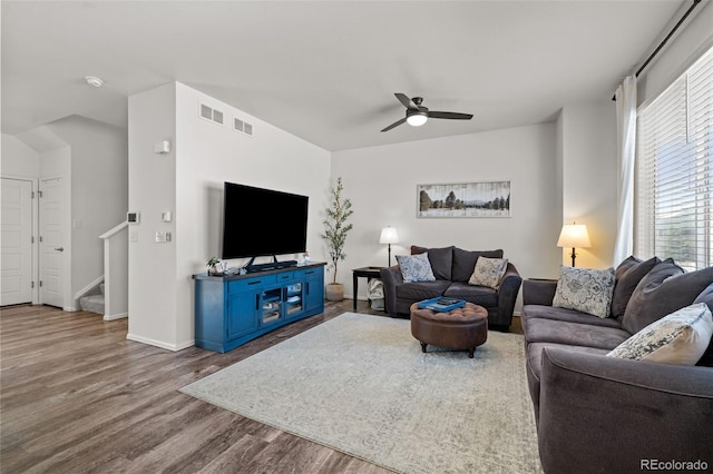 living room with hardwood / wood-style flooring and ceiling fan