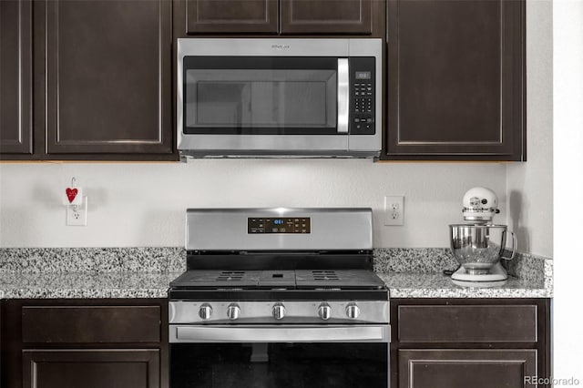 kitchen featuring dark brown cabinetry and stainless steel appliances