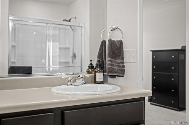 bathroom with vanity and an enclosed shower