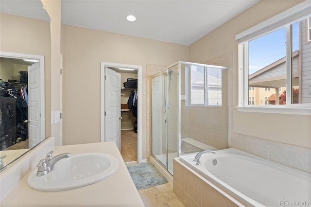 41 Jordan Ln, Erie, CO 80516 - full bath with a shower stall, a bath, vanity, and a walk in closet