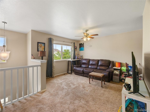 41 Jordan Ln, Erie, CO 80516 - carpeted living room with ceiling fan and baseboards