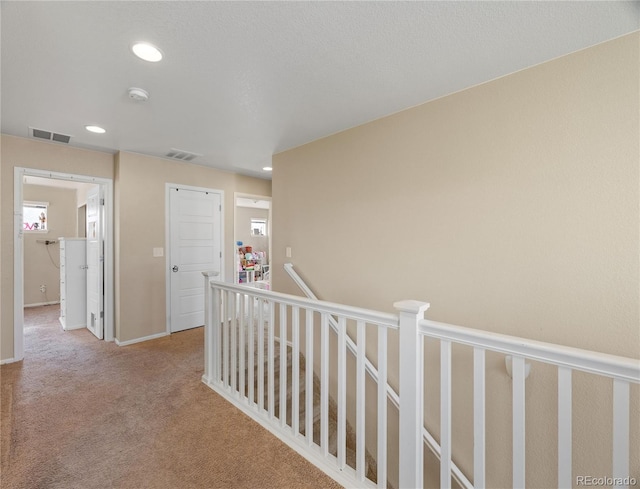 41 Jordan Ln, Erie, CO 80516 - hallway with an upstairs landing, carpet, recessed lighting, and baseboards