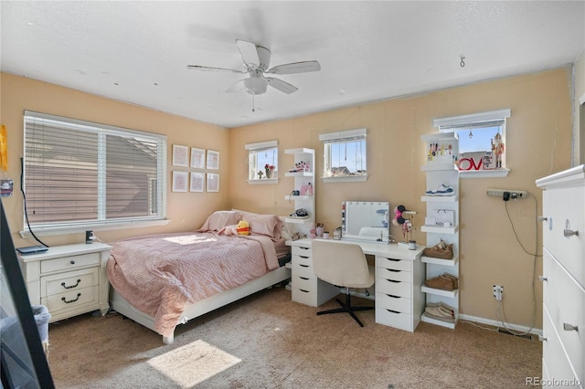 41 Jordan Ln, Erie, CO 80516 - bedroom with light carpet, a desk, and ceiling fan