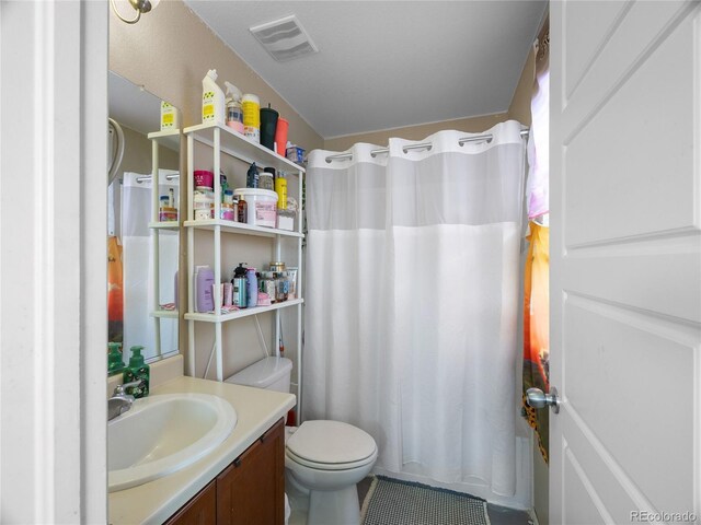 41 Jordan Ln, Erie, CO 80516 - full bath with vanity, curtained shower, toilet, and tile patterned flooring