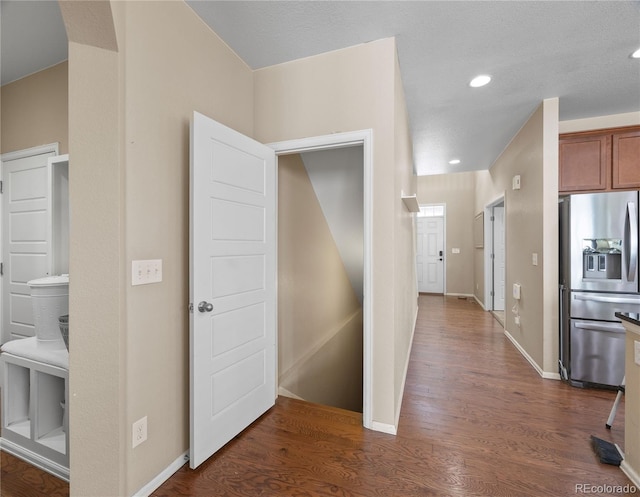 41 Jordan Ln, Erie, CO 80516 - hall featuring dark wood-style floors, recessed lighting, and baseboards
