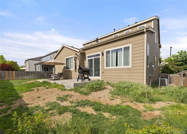 41 Jordan Ln, Erie, CO 80516 - back of house with a patio, fence, and central AC unit