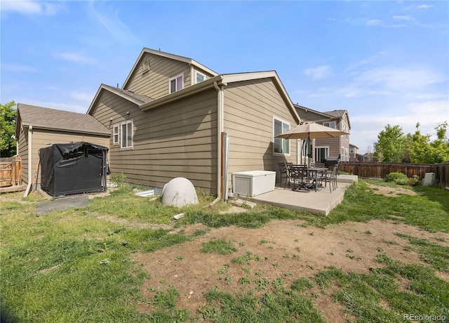 41 Jordan Ln, Erie, CO 80516 - rear view of house featuring a fenced backyard and a patio
