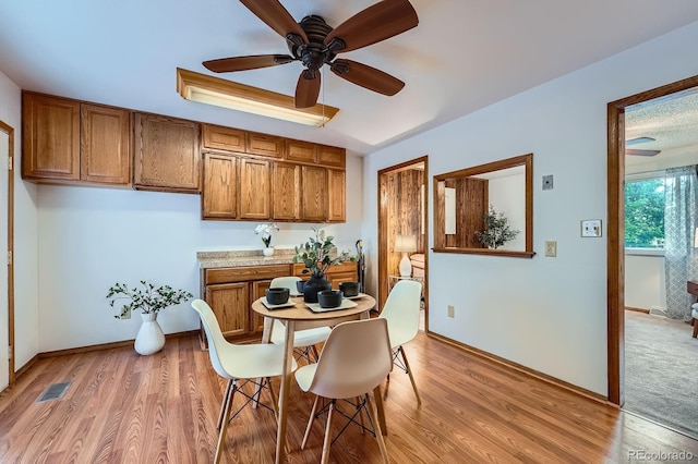 744 Memphis St, Aurora, CO 80011 - dining room featuring a ceiling fan and light wood-style flooring