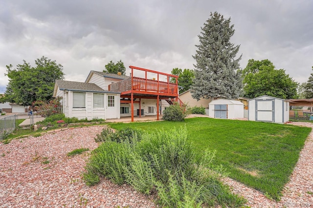 744 Memphis St, Aurora, CO 80011 - rear view of house featuring a storage unit and a wooden deck
