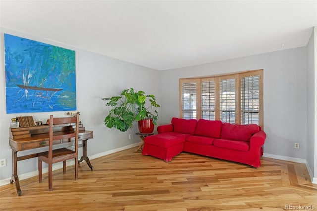 living room featuring baseboards and wood finished floors