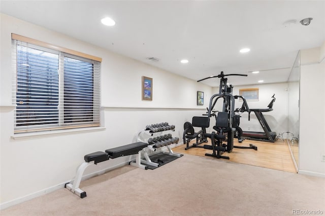 exercise area with carpet flooring, recessed lighting, baseboards, and visible vents