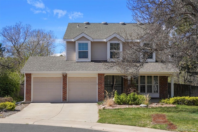 10200 Julian St, Westminster, CO 80031 - traditional home with fence, a shingled roof, concrete driveway, brick siding, and a front yard