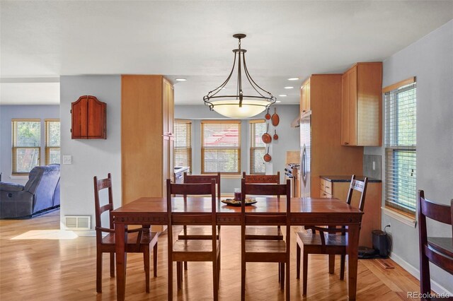10200 Julian St, Westminster, CO 80031 - dining room featuring light wood-type flooring, plenty of natural light, and visible vents