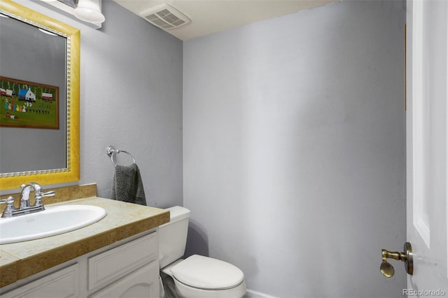 10200 Julian St, Westminster, CO 80031 - half bathroom featuring visible vents, toilet, and vanity