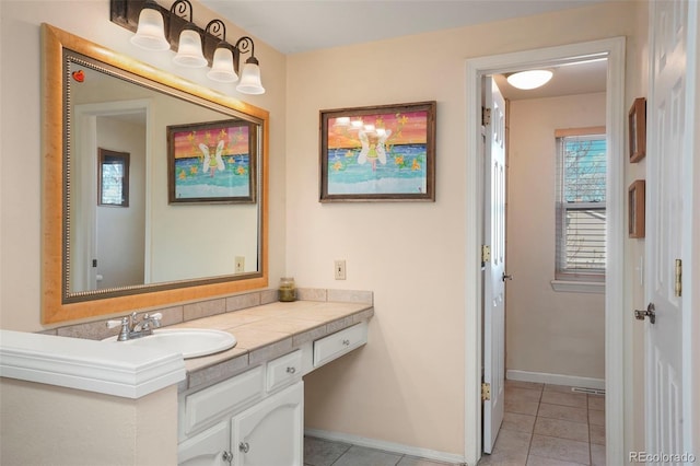 10200 Julian St, Westminster, CO 80031 - bathroom featuring vanity, baseboards, and tile patterned flooring