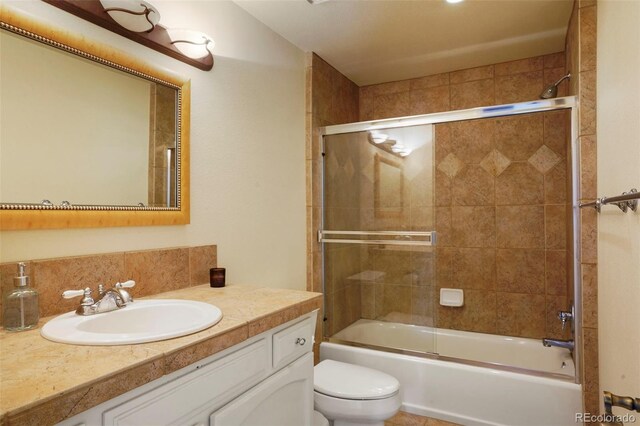 10200 Julian St, Westminster, CO 80031 - bathroom featuring enclosed tub / shower combo, toilet, and vanity