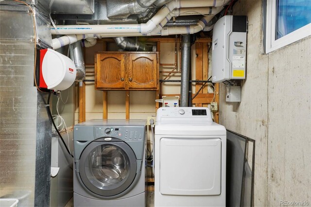 10200 Julian St, Westminster, CO 80031 - laundry room with washing machine and clothes dryer and cabinet space