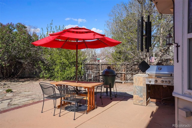 10200 Julian St, Westminster, CO 80031 - view of patio / terrace featuring outdoor dining space, area for grilling, and fence