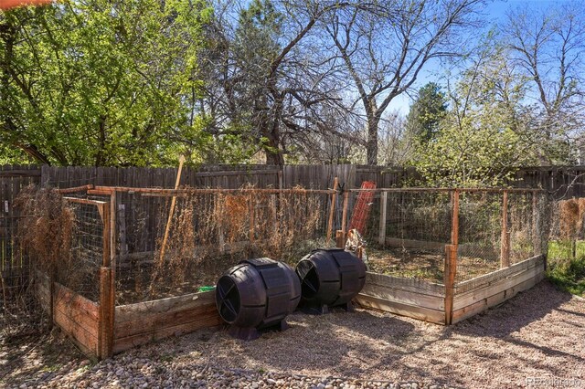 10200 Julian St, Westminster, CO 80031 - view of yard with a fenced backyard and a vegetable garden