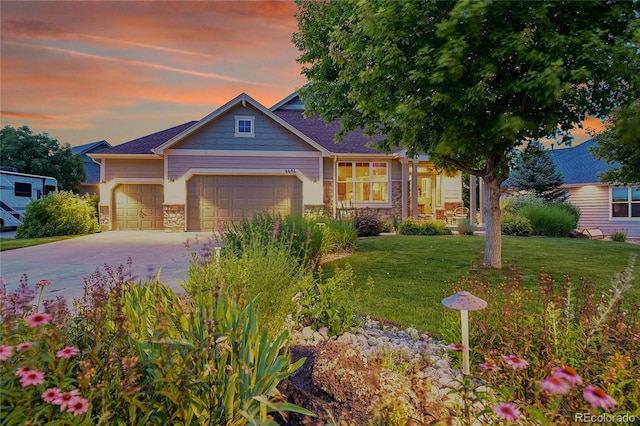 6696 S Quail Ct, Littleton, CO 80127 - view of front of house featuring stone siding, an attached garage, concrete driveway, and a front yard