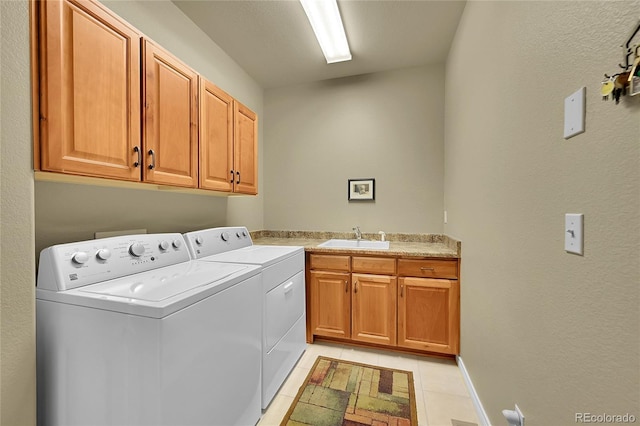 6696 S Quail Ct, Littleton, CO 80127 - laundry area with cabinet space, washer and clothes dryer, and light tile patterned floors