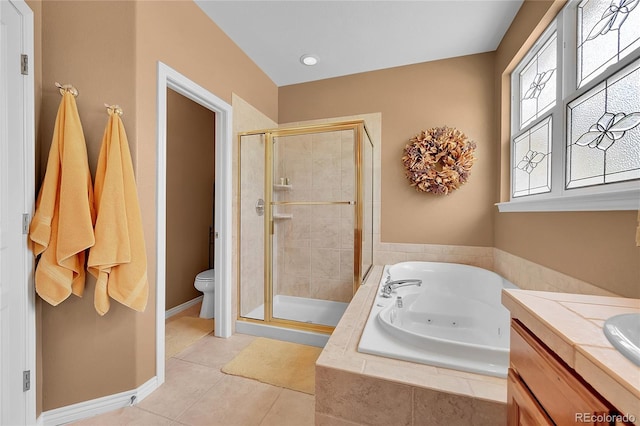 6696 S Quail Ct, Littleton, CO 80127 - bathroom with a stall shower, a jetted tub, tile patterned floors, and vanity
