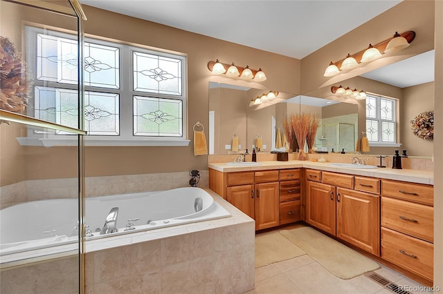 6696 S Quail Ct, Littleton, CO 80127 - full bathroom with double vanity, a jetted tub, tile patterned flooring, and a shower with shower door