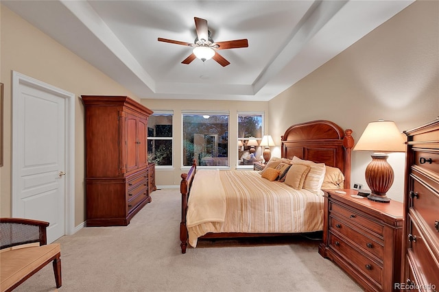 6696 S Quail Ct, Littleton, CO 80127 - bedroom with a raised ceiling, light carpet, and ceiling fan