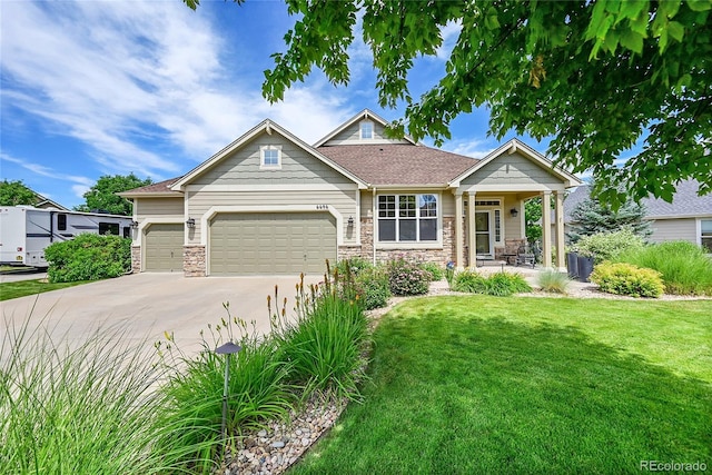 6696 S Quail Ct, Littleton, CO 80127 - craftsman house with a front yard, covered porch, an attached garage, driveway, and stone siding