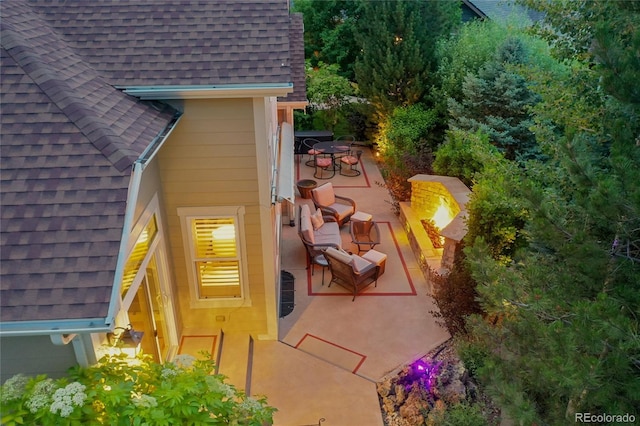 6696 S Quail Ct, Littleton, CO 80127 - exterior space with a shingled roof and a patio area