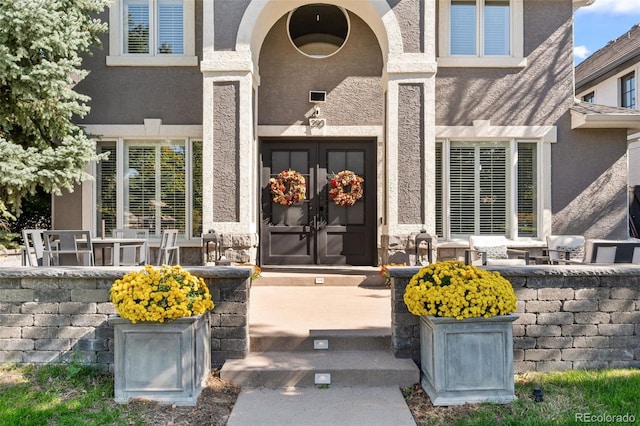 property entrance featuring french doors