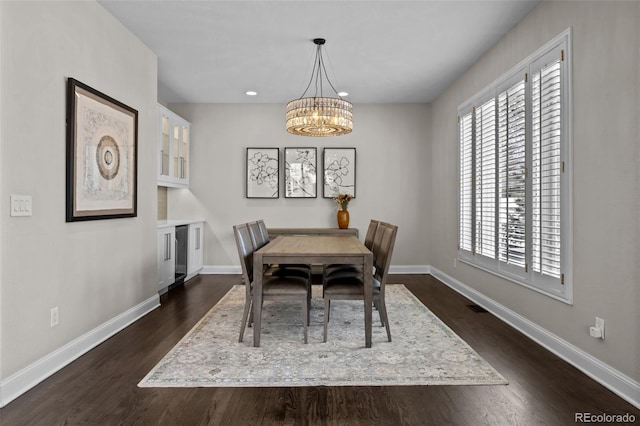 dining space with an inviting chandelier