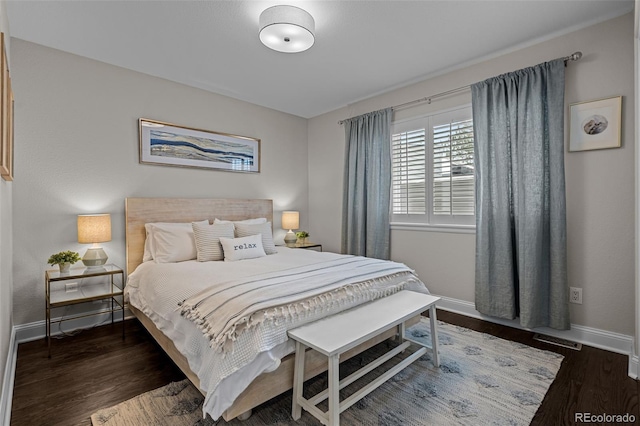 bedroom with dark wood-type flooring