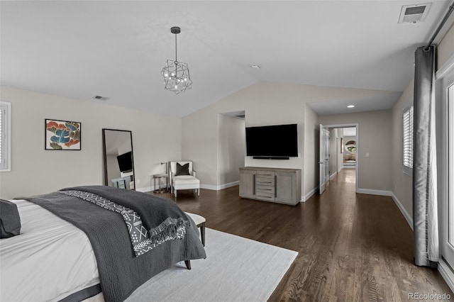 bedroom with lofted ceiling, dark hardwood / wood-style floors, and an inviting chandelier