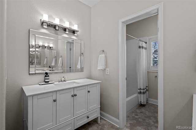 bathroom featuring vanity and shower / tub combo