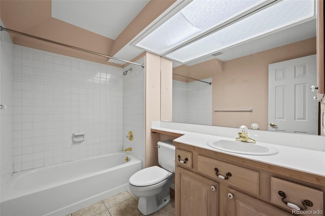 full bathroom with vanity, toilet, tiled shower / bath combo, and tile patterned flooring