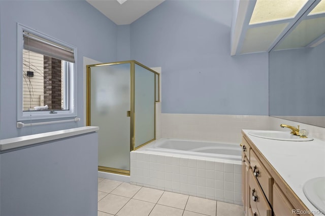 bathroom featuring vanity, tile patterned floors, and separate shower and tub