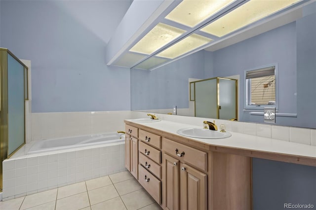 bathroom featuring independent shower and bath, vanity, and tile patterned floors