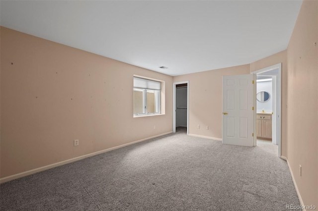 unfurnished room with light colored carpet