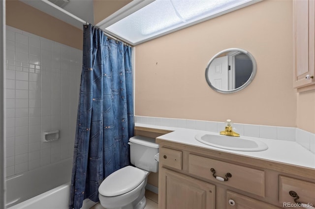 full bathroom featuring vanity, toilet, and shower / tub combo