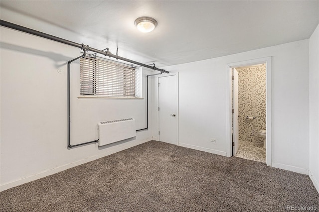 500 E 11th Ave Unit 102, Denver, CO 80203 - below grade area featuring carpet flooring and baseboards