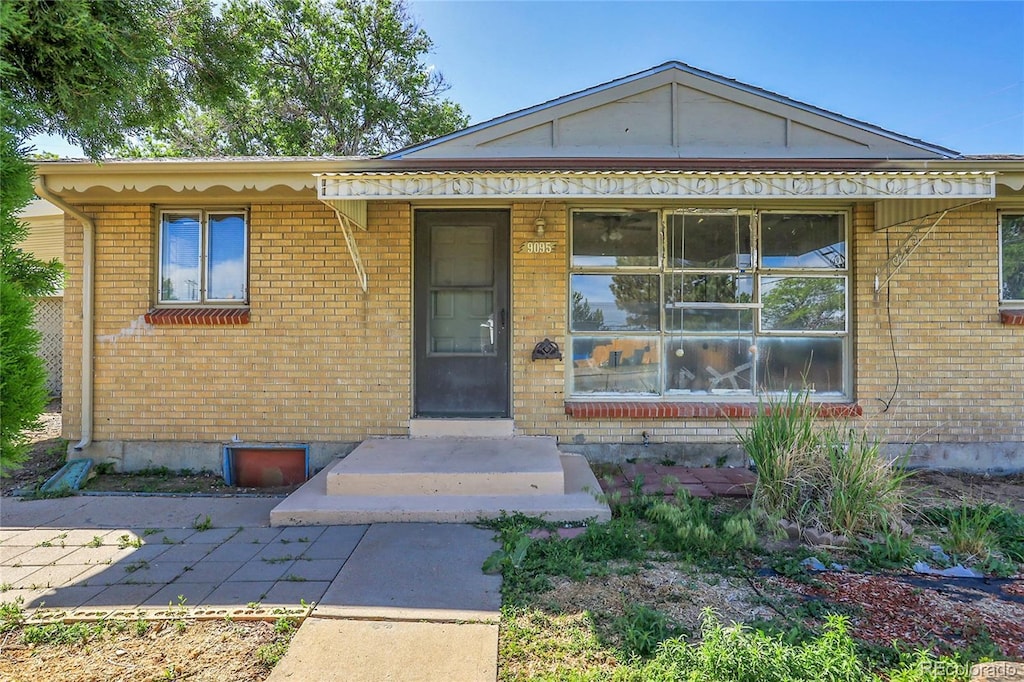 9095 Beechwood Dr, Thornton, CO 80229 - view of front facade featuring brick siding